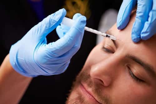 man having botox treatment at clinic-img-blog
