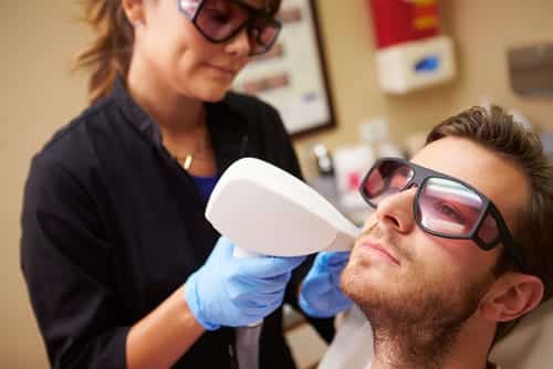 man having laser treatment at a clinic