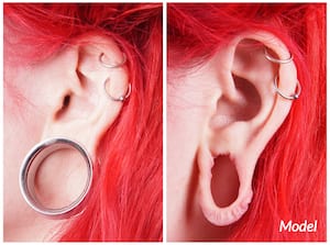 Woman with stretched earlobes who may be in need of earlobe repair surgery