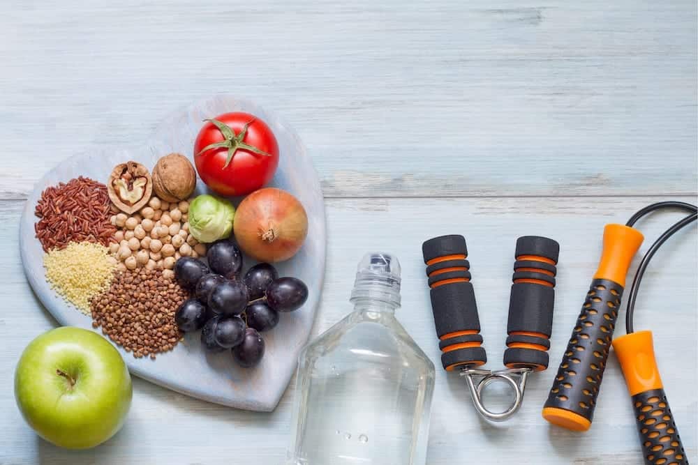 Image showing healthy snacks and exercise equipment. Materials needed for healthy lifestyle.