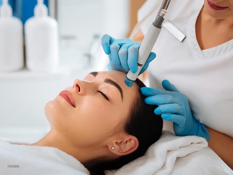 Woman getting facial procedure