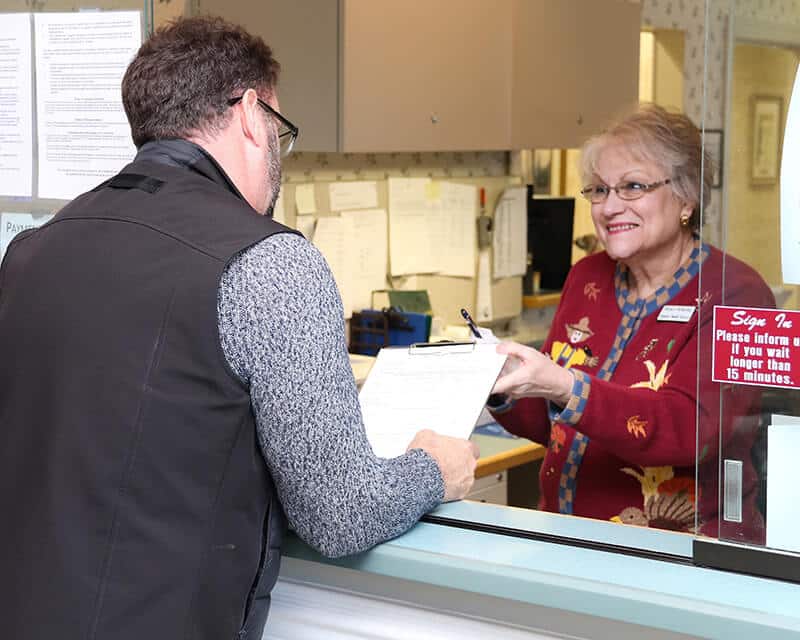 Patient at the reception desk